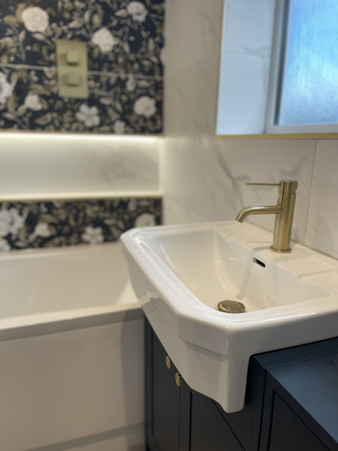 Bathroom basin and brass tap installation